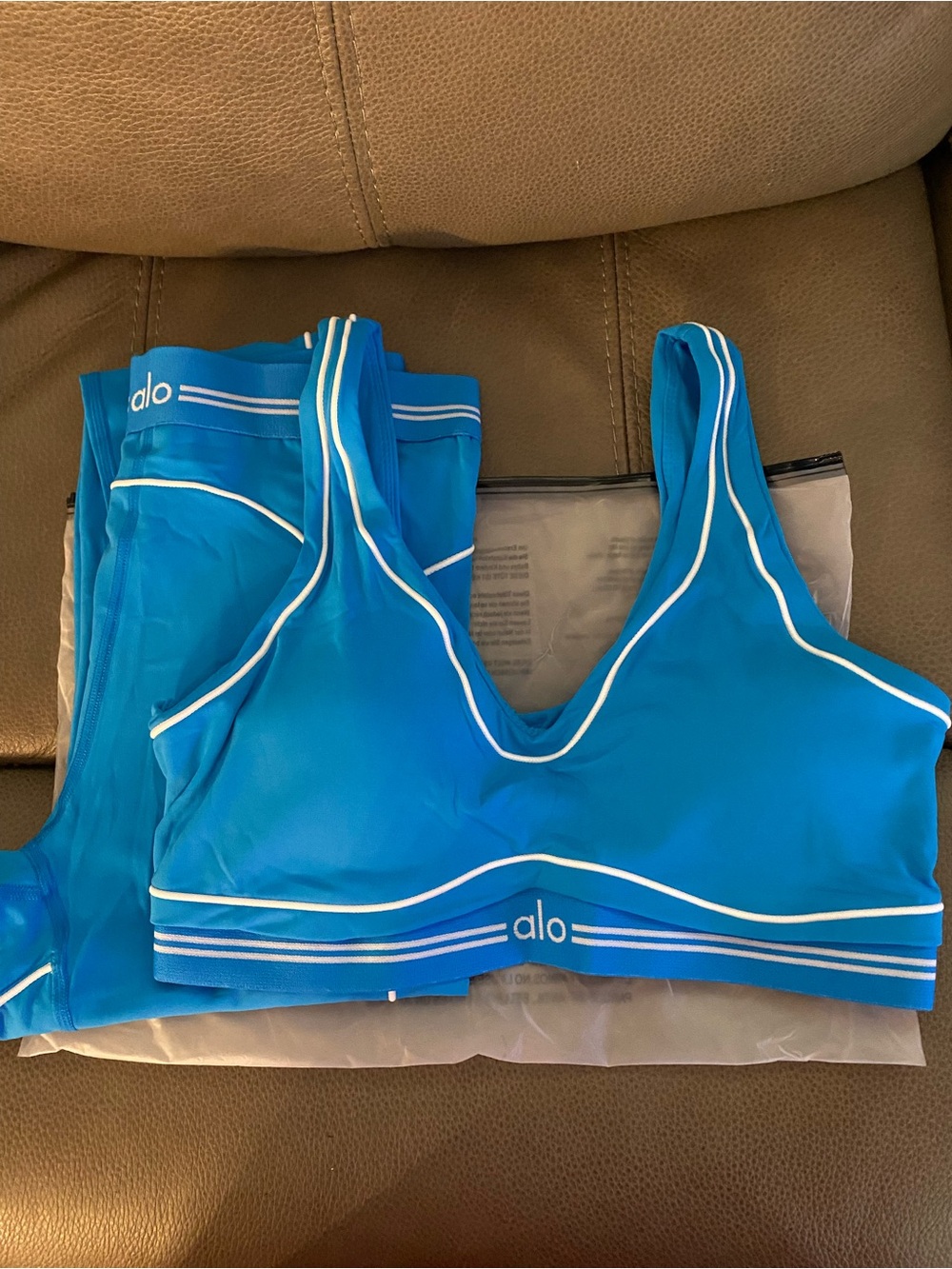 ALO Yoga Azure Blue Sports Bra and leggings set with White Piping